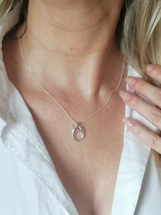 Model wearing Sterling Silver Mother and Child Oval Pendant Necklace. Meaningful Mother's Day Christmas Birthday Gift