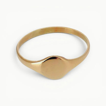 Ladies 9ct yellow gold dainty minimalist round signet ring with a highly polished finish 