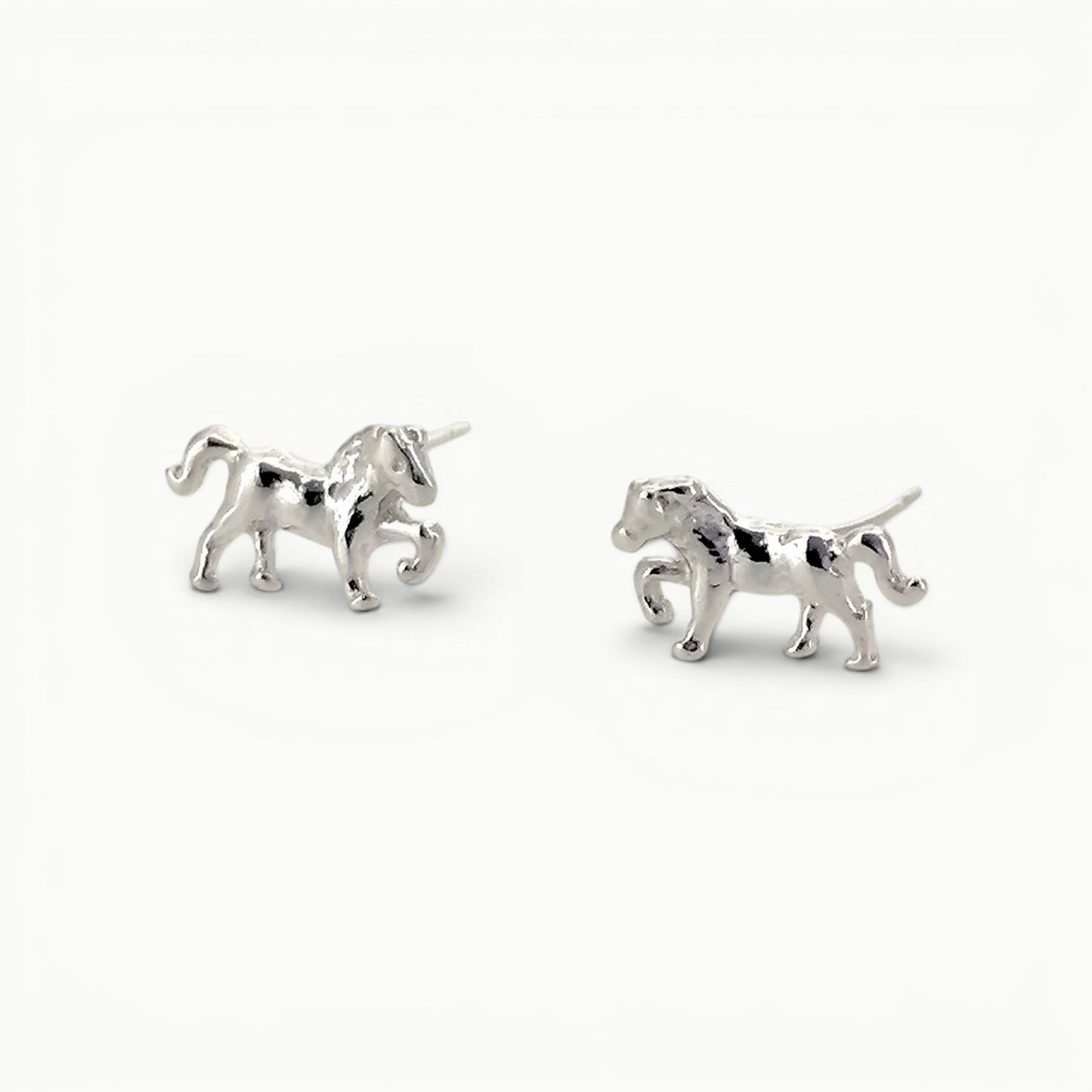 Sterling silver small prancing pony horse stud earrings. 