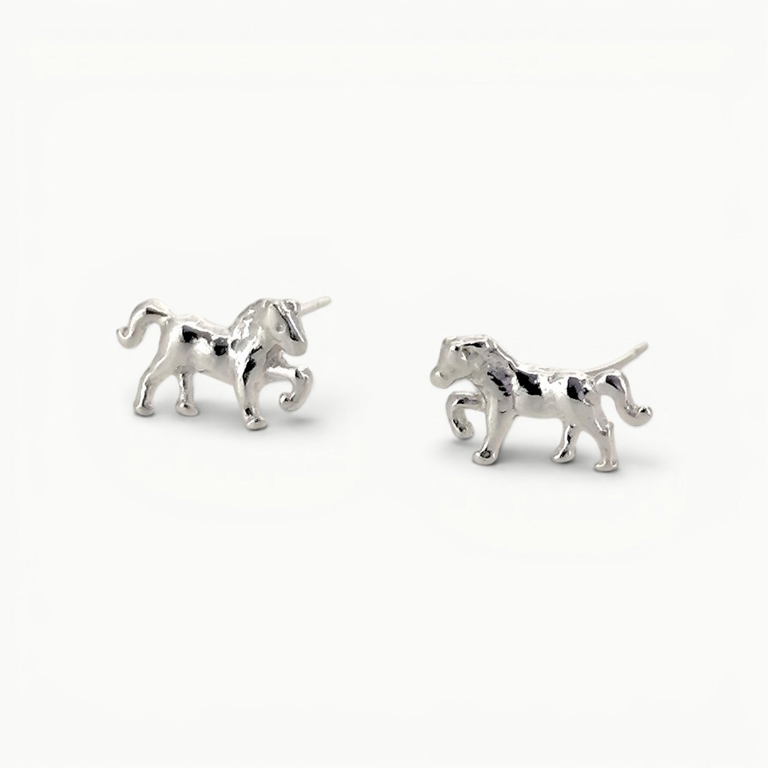 Sterling silver small prancing pony horse stud earrings. 