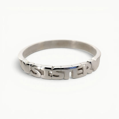 Sterling silver sister word band ring with featured hearts