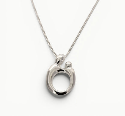 Sterling silver Mother and Child oval pendant on an 18" curb link chain. 