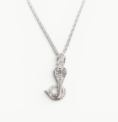 Sterling silver cobra pendant on a 20" belcher chain 