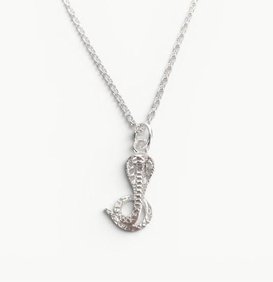Sterling silver cobra pendant on a 20" belcher chain 