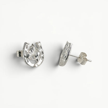 Sterling silver horseshoe with horse head studs earrings side view. 