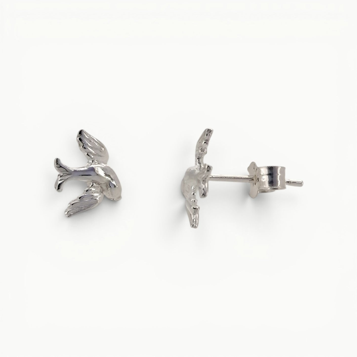 Sterling silver swallow stud earrings side view. 