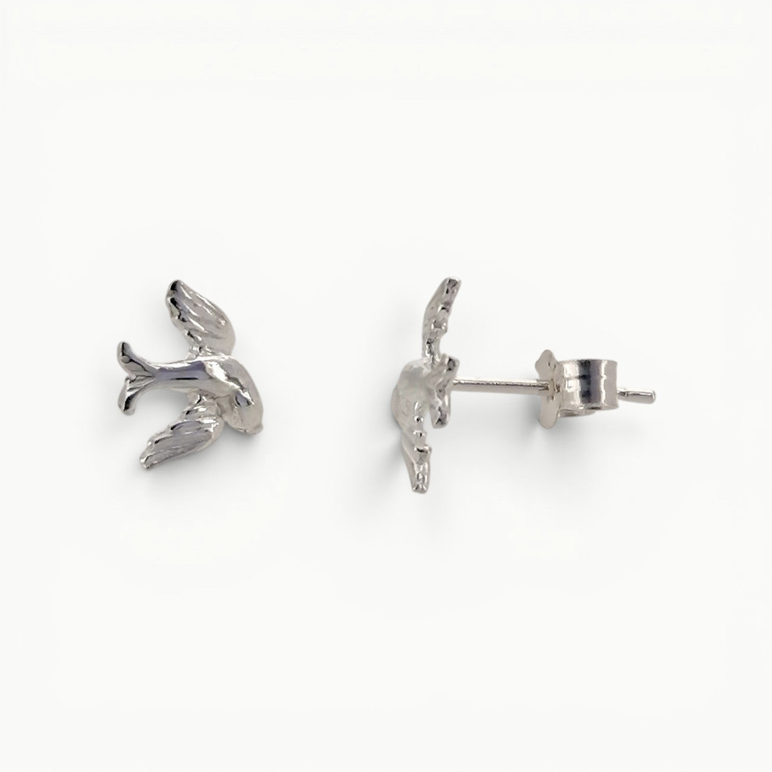 Sterling silver swallow stud earrings side view. 
