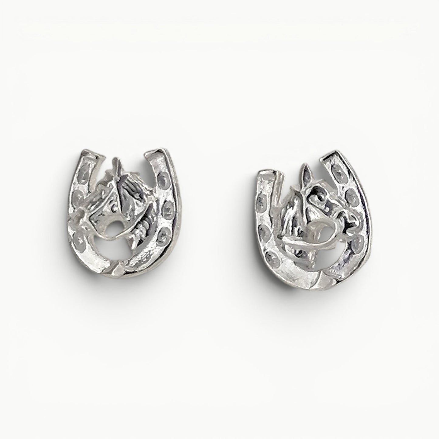 Sterling Silver horseshoe with horse head stud earrings. 