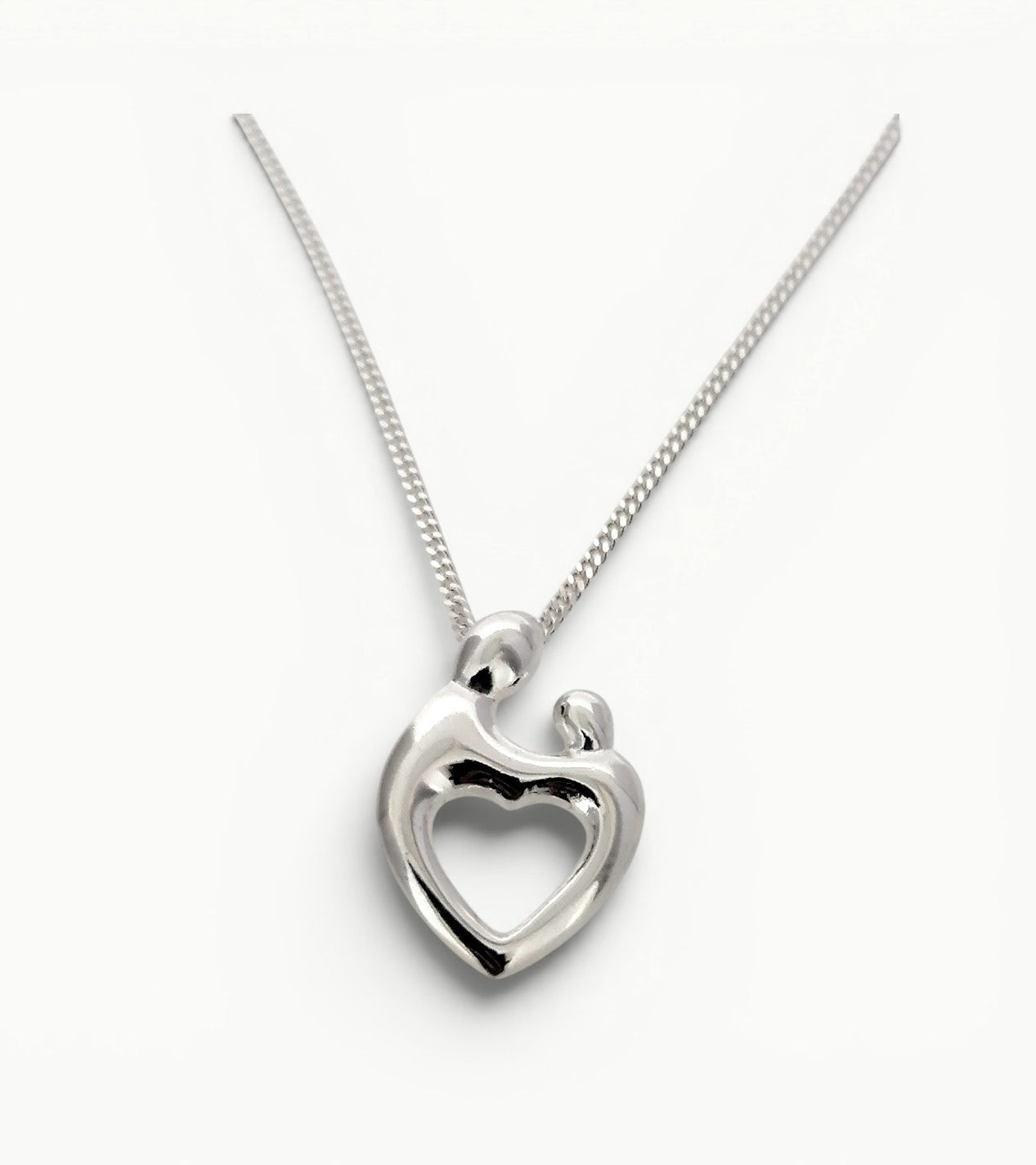Sterling silver Mother and Child heart shape pendant. 