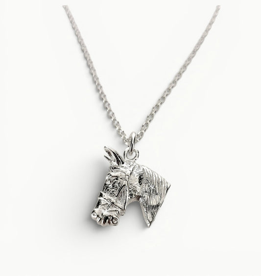 Sterling silver horse head charm pendant on a 22" belcher link chain. 