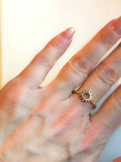 9ct yellow gold sun ring worn on ladies hand