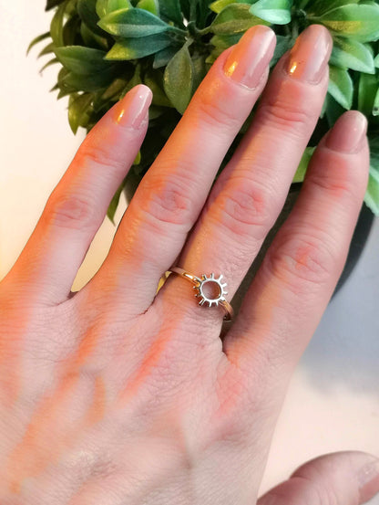 9ct yellow gold sun rays ring worn on ladies hand