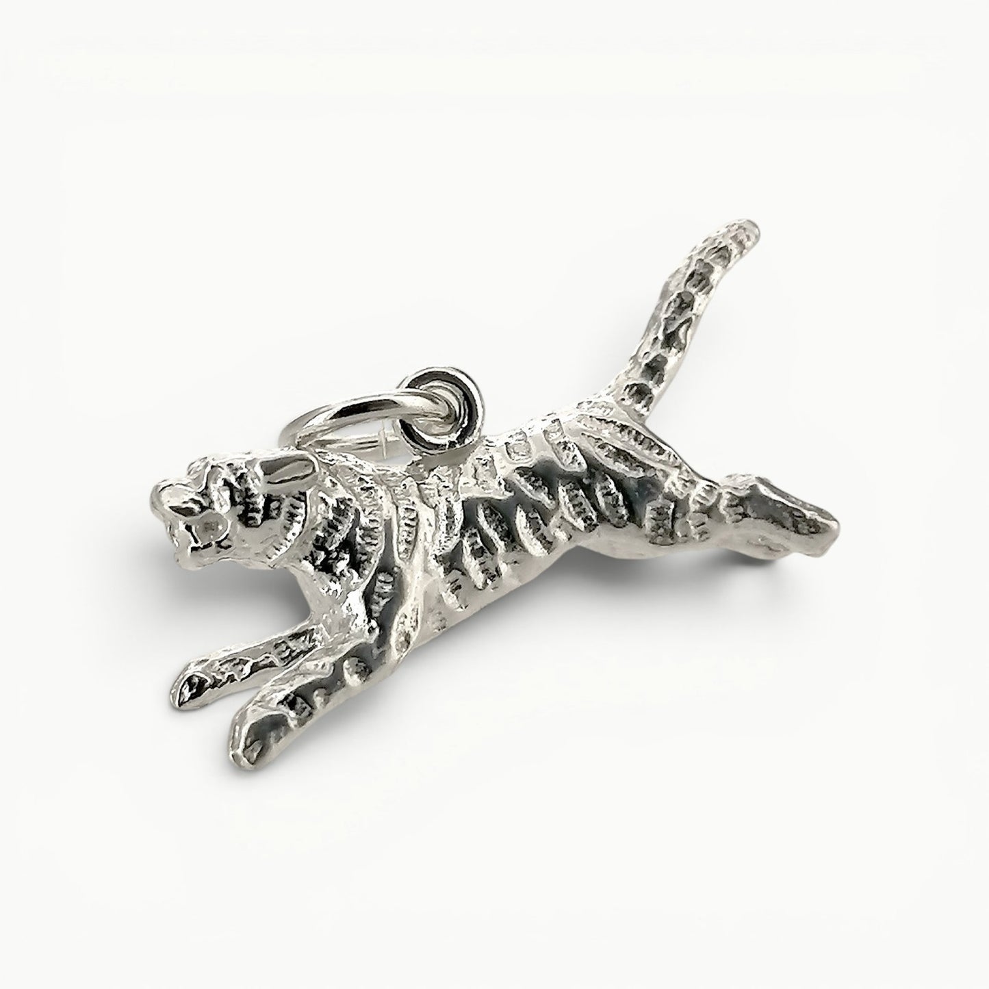 Sterling silver leaping tiger charm pendant.